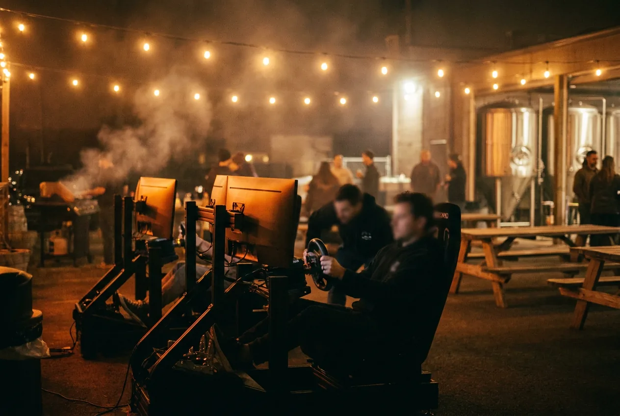 Sim rigs glowing under string lights at an outdoor brewery activation at night